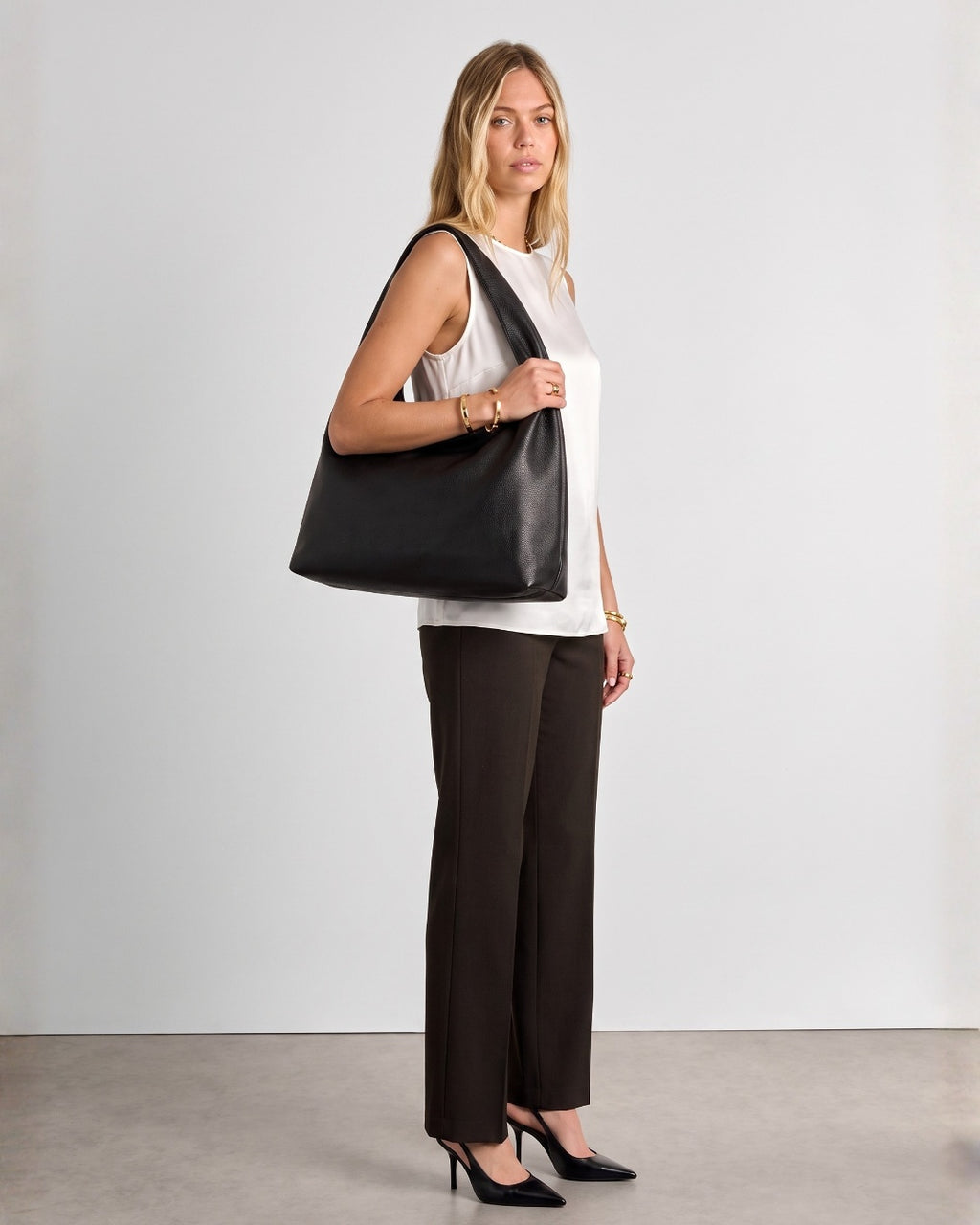 Black Elodie Shoulder Bag worn over the shoulder