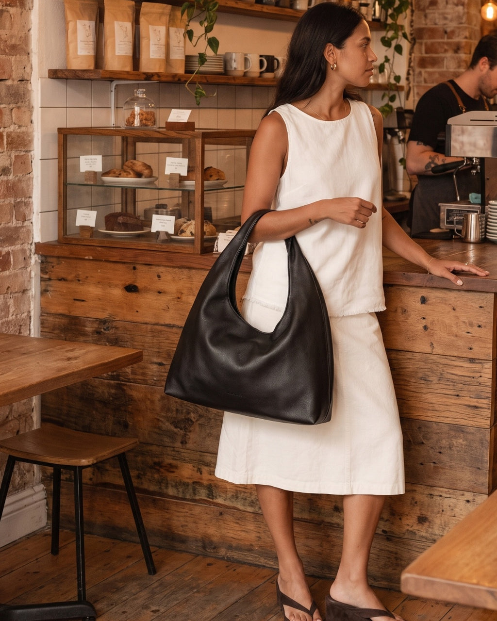 Elodie Shoulder Bag in black, detail of hardware and strap